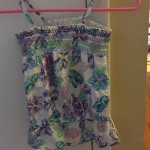 A white & rainbow colored spaghetti strap tank top